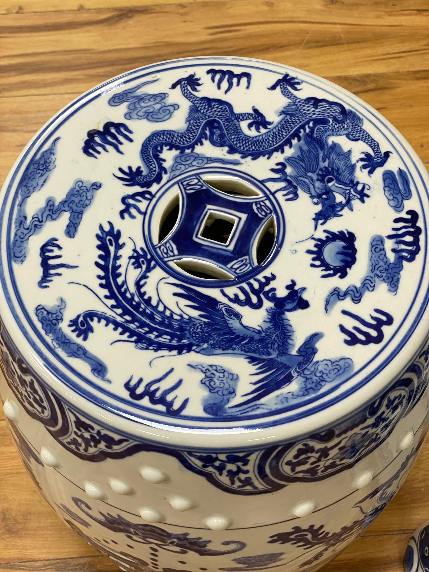 A Chinese blue and white ceramic garden seat and a similar elephant seat, 47.5cm tall